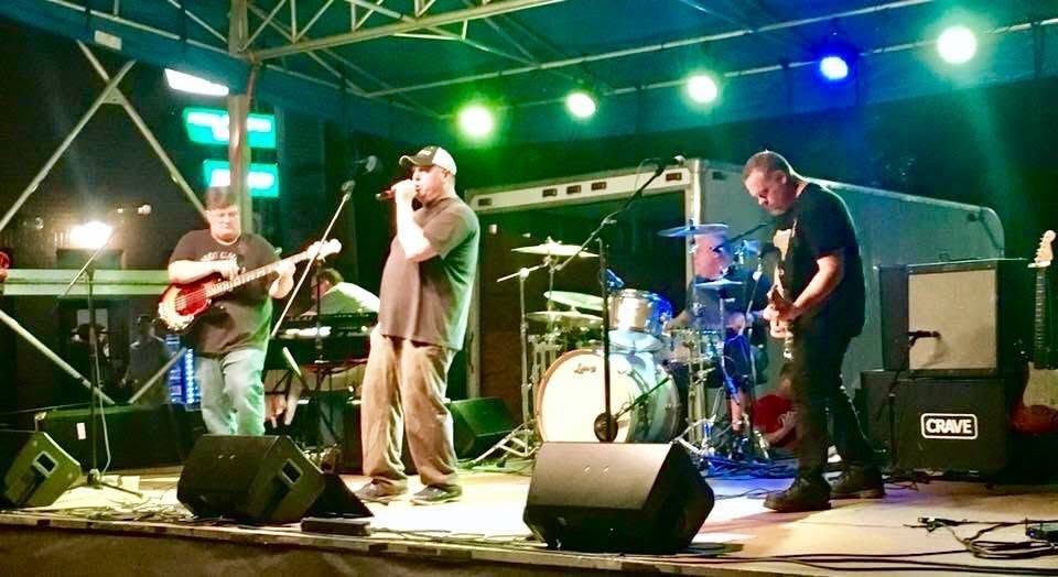 Crave playing an outdoor stage at night.