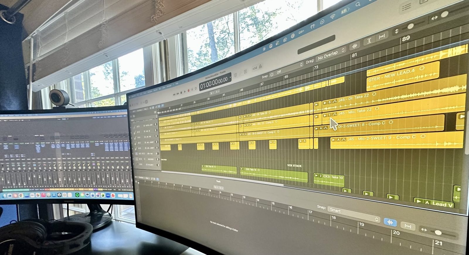 A Logic Pro session with stacked guitar and vocal takes.